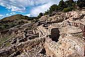 The palace of Festos. The West Court and Theatral Area, storage pits in the foreground.